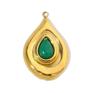 Detail of a teardrop-shaped natural stone pendant with a gold textured finish frame