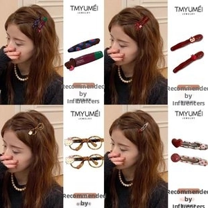 Close-up of cute cartoon hair clips and kitty glasses frames with heart and dot patterns