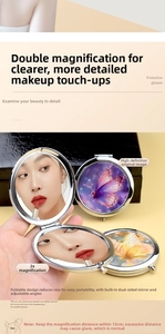 Detail of metal makeup mirror with 2X magnification side and high-definition normal view