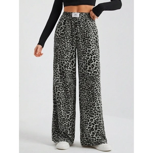 Detailed macro view of leopard print wide-leg trousers with an elastic waistband design