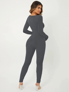 Detail of grey ribbed long sleeve bodysuit showing the slim fit back and knitted texture