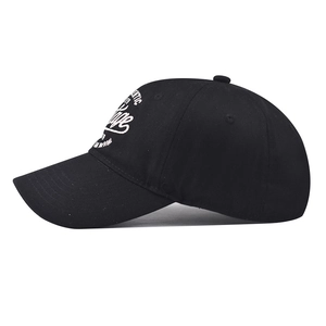 Detail of authentic vintage brand white embroidery on black cotton baseball cap