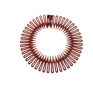 Brown retractable circular hair comb and headband for easy styling on white background