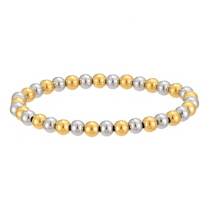 Detailed view of two-tone gold and silver beaded stainless steel elastic bracelet