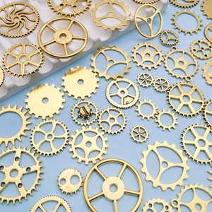 Macro detail of various vintage style golden alloy mechanical gears for DIY jewelry design
