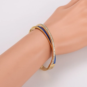 Gold-plated stainless steel wrap bracelet with blue enamel and sparkling pavé crystals