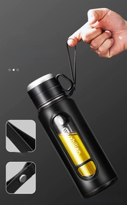 Detail view of thickened carrying rope and reinforced metal rivets on black tea tumbler