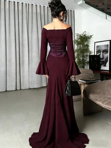 Elegant deep purple off-shoulder evening gown with ruched waist and fishtail hem