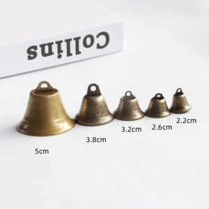 Set of 5 vintage bronze metal bells in various sizes ranging from 2.2cm to 5cm diameter