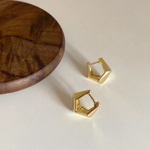 Minimalist gold geometric rectangular hoop earrings for women on a wooden stand