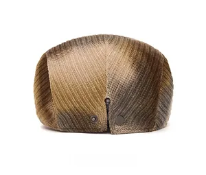 Rear view of tie-dye beret showing gradient texture and metal decorative hardware