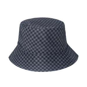 Women's reversible checkerboard bucket hat in grey and white canvas for sun protection