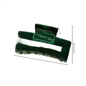 Detail of St. Patrick's Day green checkerboard hair claw clip measuring 8.5x5cm