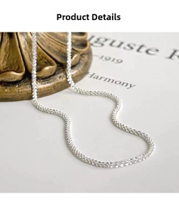 Close-up detail of a 925 sterling silver chain necklace with shimmering Italian craftsmanship