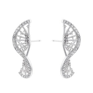 Macro shot of curved silver earrings with detailed pavé set white cubic zirconia stones