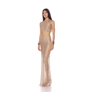 Champagne gold crochet two-piece set featuring sleeveless crop top and long fishtail skirt