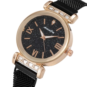 Macro view of women's quartz watch featuring a starry sky dial and crystal lugs
