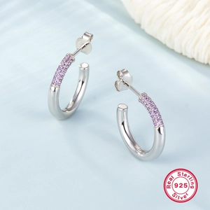 Macro shot of S925 sterling silver half-hoop earrings with paved purple zircon stones