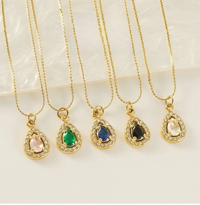 Detailed view of five teardrop zircon pendants in assorted colors with 18K gold plated chains