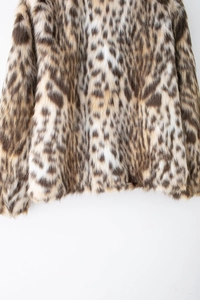 Close-up detail of soft faux fur texture with stylish leopard print pattern