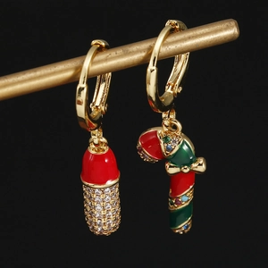 Asymmetric Christmas earrings with oil-drop candy cane and red zircon capsule pendants