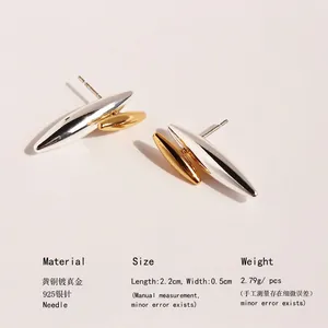 Two-tone gold and silver rivet stud earrings in brass with 925 silver needles