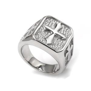 Detailed view of silver stainless steel ring with gothic cross relief and stone texture