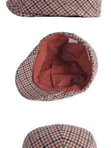 Détails du tissu en laine pied-de-poule, doublure rouge et étiquette d'entretien du béret
