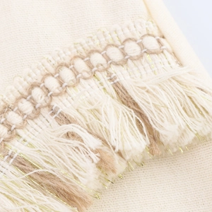 Women's vacation style two-piece set with cream woven fabric and tassel fringe details