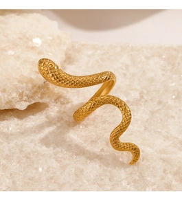 Detailed view of the gold snake ring featuring intricate scale textures on white crystals
