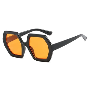 Polygonal sunglasses with thick black frames and vibrant orange lenses from 45-degree angle