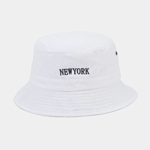 Detail of New York embroidery and metal eyelets on white vintage cotton bucket hat
