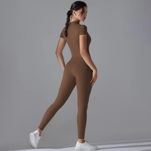 Close-up of brown high-elastic yoga jumpsuit with short sleeves and back zipper detail