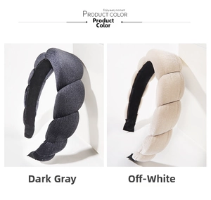 Detail of twisted velvet padded headbands in dark grey and cream white colors