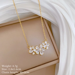 Detail of flower pendant necklace with dimensions and weight specs on silk background