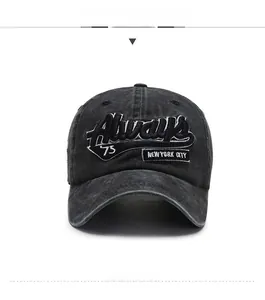 Detailed embroidery of Always 75 New York City on a washed dark gray baseball cap