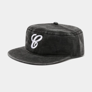 Macro view of vintage grey flat top cap with white embroidered letter C on washed canvas