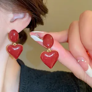 Elegant red enamel heart earrings with gold finish and vintage oval studs for women