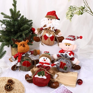 Set of 4 Christmas drawstring gift bags featuring Santa, Reindeer, Snowman, and Elf