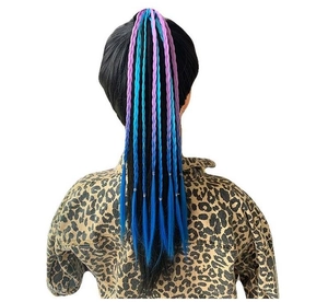 Detail of child's colorful braided ponytail with blue and purple ombre hair extension
