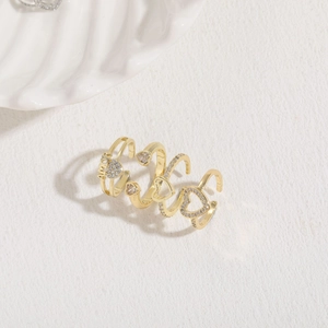 Three-piece adjustable gold ring set with heart motif, AMOR letters and clear zircon accents