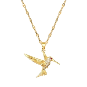 Titanium steel hummingbird necklace with crystal pavé wings and red eye on gold chain
