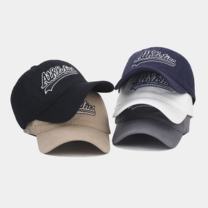 Detail shot of five colors of vintage baseball caps with white Athletics embroidery