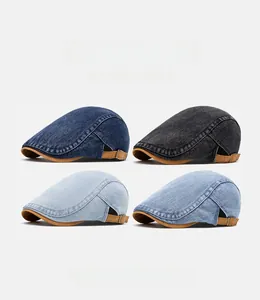 Detail view of denim beret hats in four colors with brown leather adjustment straps