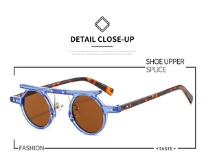 Detail of round punk sunglasses with blue transparent frame and tortoiseshell temples