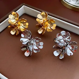 Chic 3D metallic floral cluster stud earrings in gold and silver set on leather