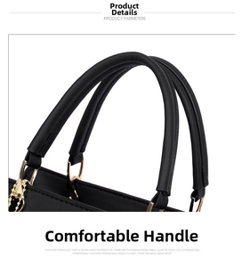 Detail of comfortable round handles and soft texture on black leather handbag