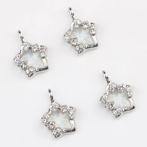 Elegant silver star pendant with white pearlescent inlay and sparkling rhinestones