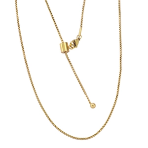 Close-up of adjustable gold-plated slider clasp and bead detail on a box chain