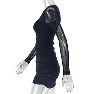 Detail of ruched slim fit mini dress featuring sheer mesh sleeves and elastic knit fabric